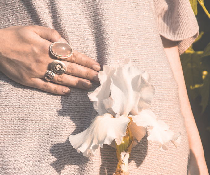 WSHC Cincinnati Women's Health woman holding abdomen with flower