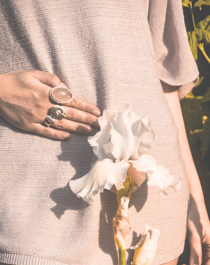 WSHC Cincinnati Women's Health woman holding abdomen with flower