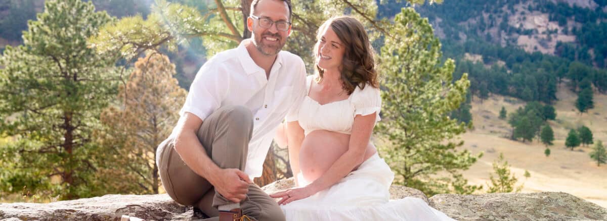 A picture of holistic doctors, Dr. Curtis and Dr. Spears, during their maternity photoshoot in Boulder, CO